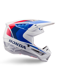 Kask Alpinestars Honda S-M5 Helmet ECE, kask motocrossowy, biały, niebieski i czerwony, widok z profilu, aerodynamiczny design ze zintegrowanym daszkiem, liczne otwory wentylacyjne, błyszczące wykończenie, wyraźne logo Honda i Alpinestars