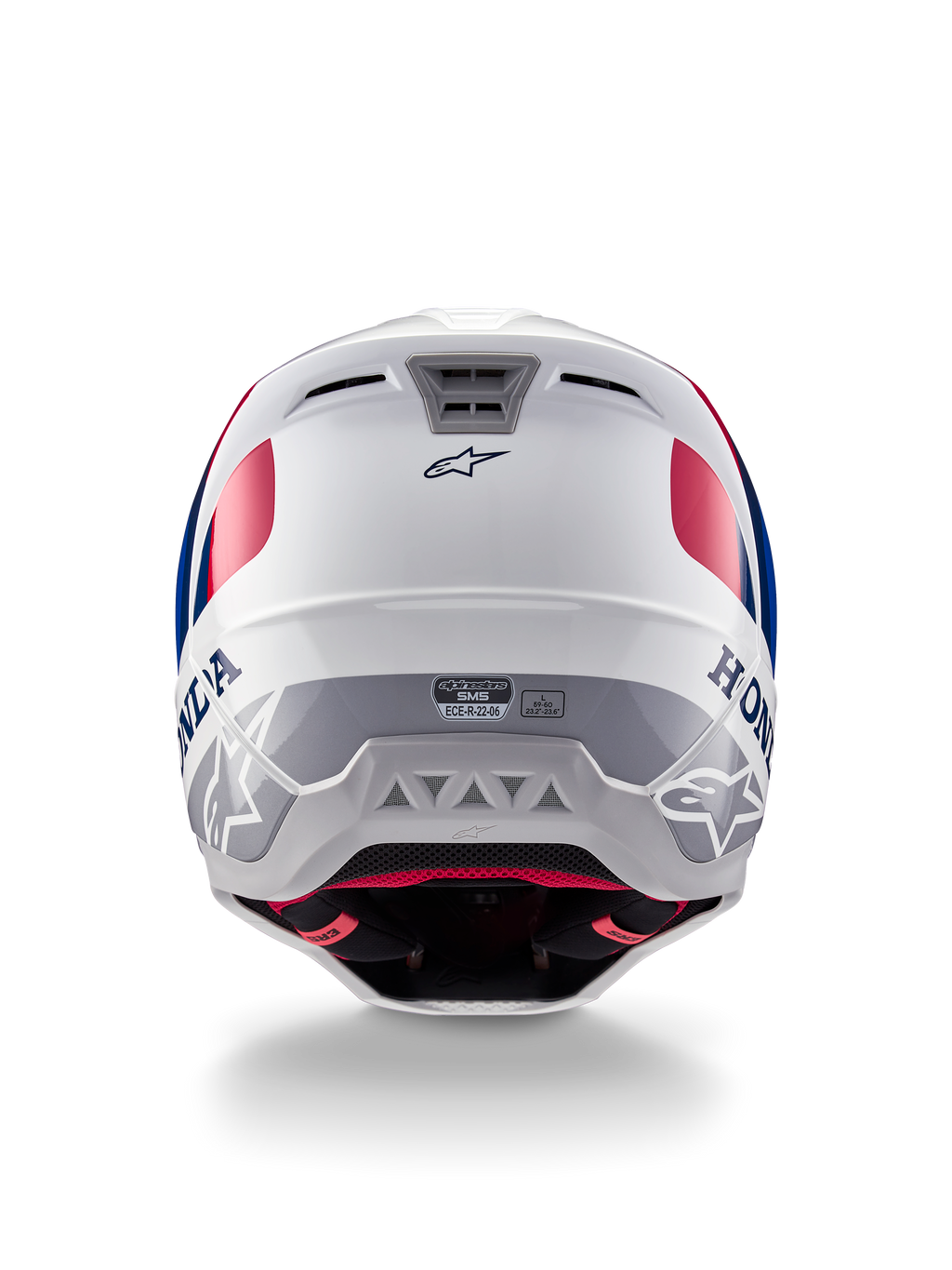 Kask Alpinestars Honda S-M5 ECE, kask motocrossowy, biało-niebiesko-czerwony z połyskiem, widok z tyłu ukazujący branding Honda i Alpinestars, aerodynamiczna skorupa ze zintegrowanymi wylotami wentylacyjnymi i etykietą certyfikacji ECE.