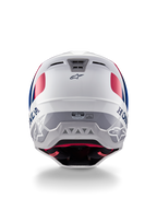 Kask Alpinestars Honda S-M5 ECE, kask motocrossowy, biało-niebiesko-czerwony z połyskiem, widok z tyłu ukazujący branding Honda i Alpinestars, aerodynamiczna skorupa ze zintegrowanymi wylotami wentylacyjnymi i etykietą certyfikacji ECE.