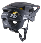 Kask MTB Alpinestars Vector Tech A1, kask do jazdy na rowerze górskim, czarny matowy z jasnoszarymi akcentami, profil boczno-tylny ukazujący otwory wentylacyjne, białe logo gwiazdy Alpinestars, branding ASTARS oraz widoczna żółta wkładka MIPS, z regulowanym czarnym paskiem podbródkowym.