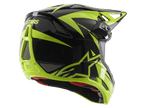 Kask Alpinestars Missile Tech-Air Full Face, czarno-żółty neonowy z połyskiem, widok z tyłu pod kątem trzech czwartych, duże siatkowe otwory wentylacyjne, logo ASTARS i czerwona wyściółka, przeznaczony do downhillu MTB.