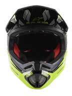 Kask Alpinestars Missile Tech-Air® Full Face, kask MTB typu full face, czarny i żółty fluorescencyjny z połyskiem, widok z przodu z napisem „One Goal. One Vision.” na daszku, czerwona wewnętrzna wyściółka, siatkowe otwory wentylacyjne i logo ASTARS na osłonie szczęki