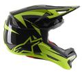 Kask Alpinestars Missile Tech-Air Full Face, kask MTB do downhillu, czarny i żółty fluo z połyskiem, widok z profilu z aerodynamicznymi siatkowymi otworami wentylacyjnymi, duże fluorescencyjne żółte logo gwiazdy i branding MISSILE TECH, czerwona wyściółka wewnętrzna, smukły wyczynowy design do kolarstwa górskiego