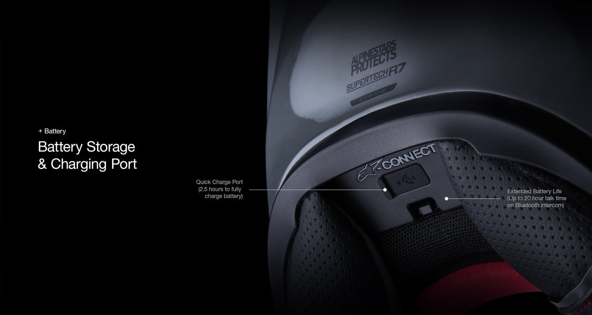Alpinestars A-Connect Communication System, close-up view of the battery storage and quick-charge USB-C port installed on the S-R7 helmet, Black, featuring Alpinestars Protects and Supertech R7 branding