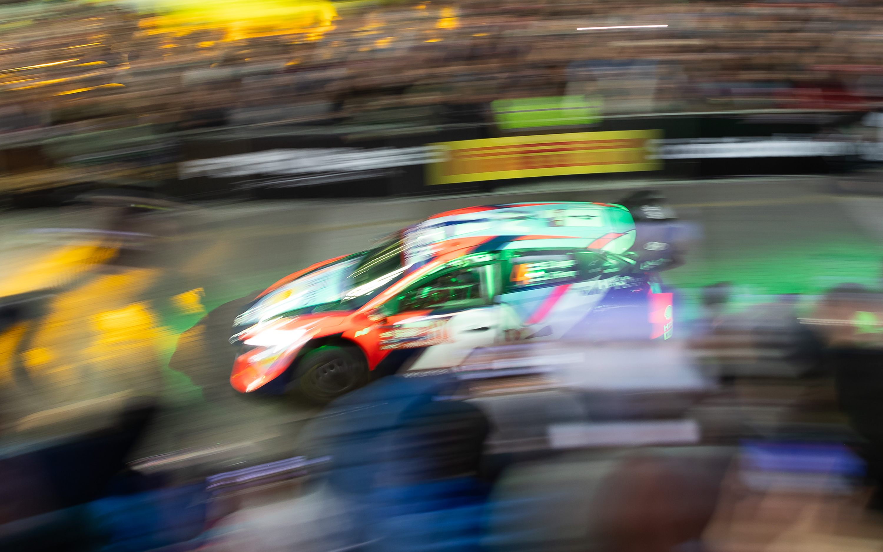 Blurry image of Esapekka Lappi racing in his Hyundai i20 rally car