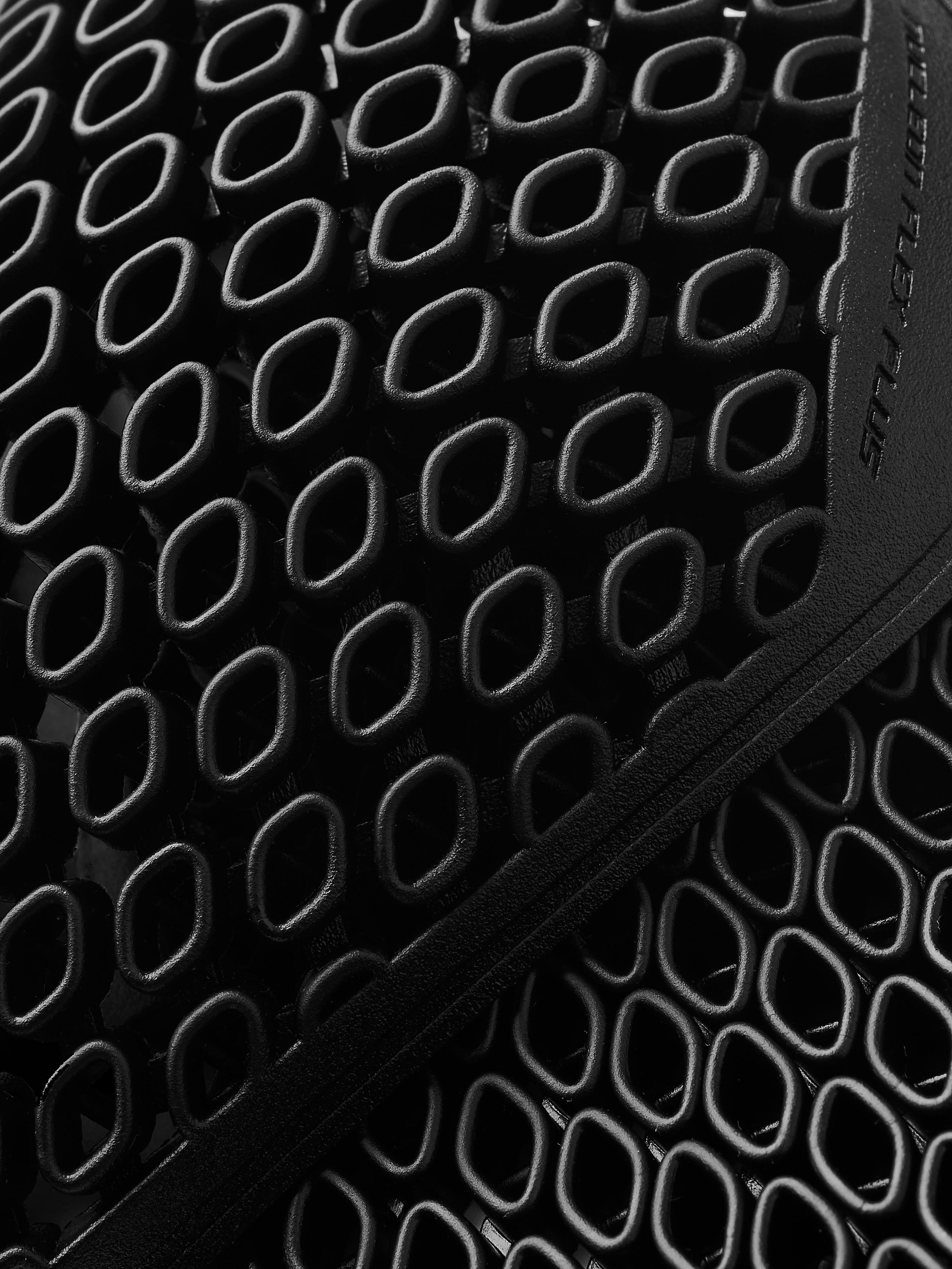 Alpinestars Nucleon Flex Plus Protectors, Black, flexible CE Level 1 armor for motorcycle jackets, close-up detail.