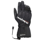 Rękawice Alpinestars XT-5 GORE-TEX, czarne rękawice motocyklowe, z białym brandingiem Astars i pomarańczowym napisem ADV-TECH, konstrukcja z długim mankietem i zakrytą ochroną kostek, logo GORE-TEX i zapięcie na sznurek ściągający, odzież adventure touring