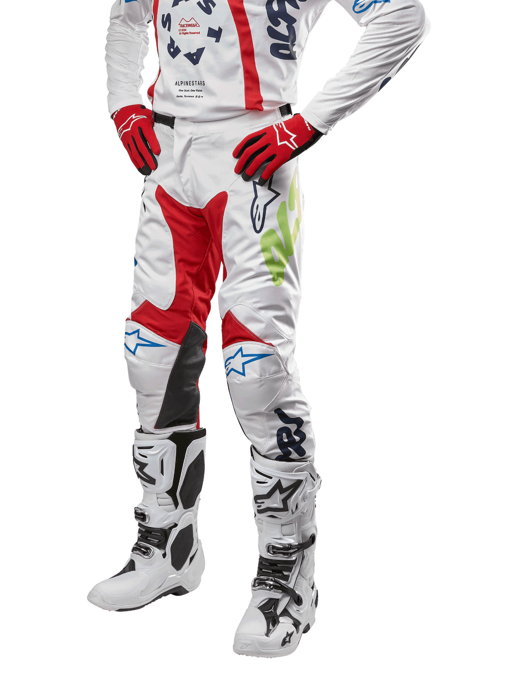 Alpinestars 2024 Racer Hana Pants, spodnie motocrossowe, białe z czerwonymi, niebieskimi i limonkowymi akcentami, ochronna konstrukcja ze skórzanymi panelami na kolanach, kompletny zestaw z pasującą bluzą, czerwonymi rękawicami i białymi butami z klamrami, sportowy design wyścigowy