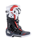 Alpinestars Tech 10 Supervented Boots, buty motocrossowe, czarne, białe, szare i czerwone, widok z boku z wieloma zapięciami na klamry, wentylowanymi panelami i czerwonym logo Alpinestars, techniczny design obuwia off-road