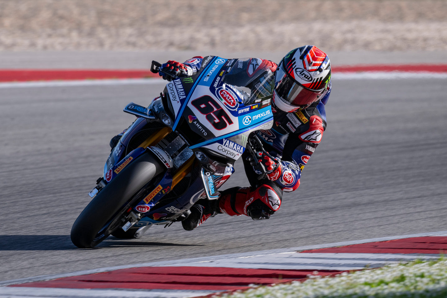 Jonathan Rea in Alpinestars racing gear on a Yamaha bike on a race track