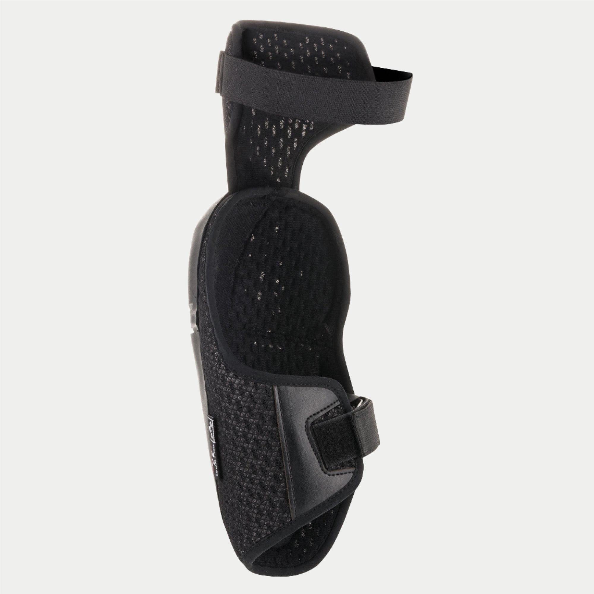 Alpinestars Youth Bionic Plus Knee Protector, czarny, widoczna wewnętrzna wyściółka z siatki i podwójny system zapięcia na paski, ergonomiczna konstrukcja zapewniająca ochronę w motocrossie i off-roadzie